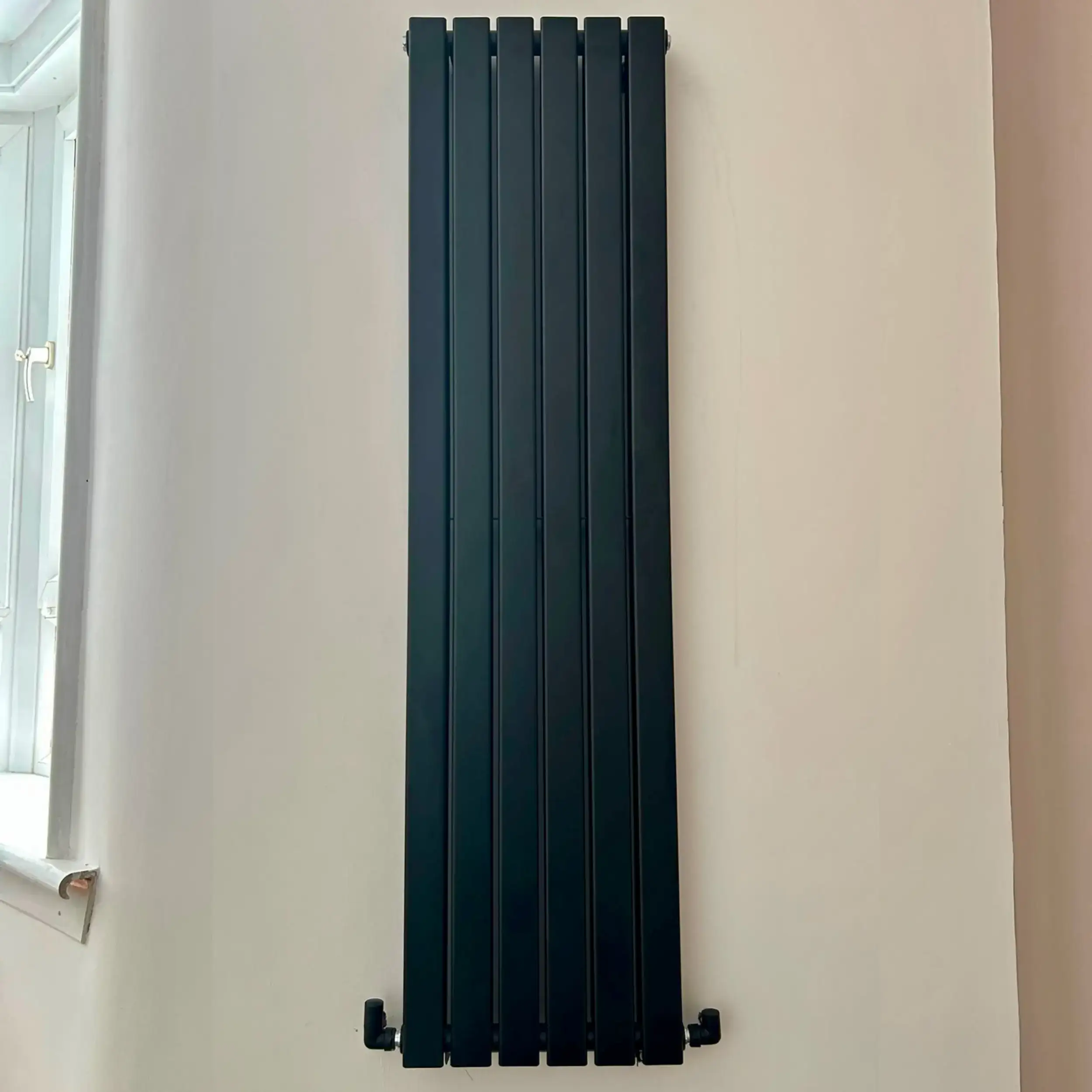 Vertical designer radiator installation carried out by NB Gas & Plumbing.
