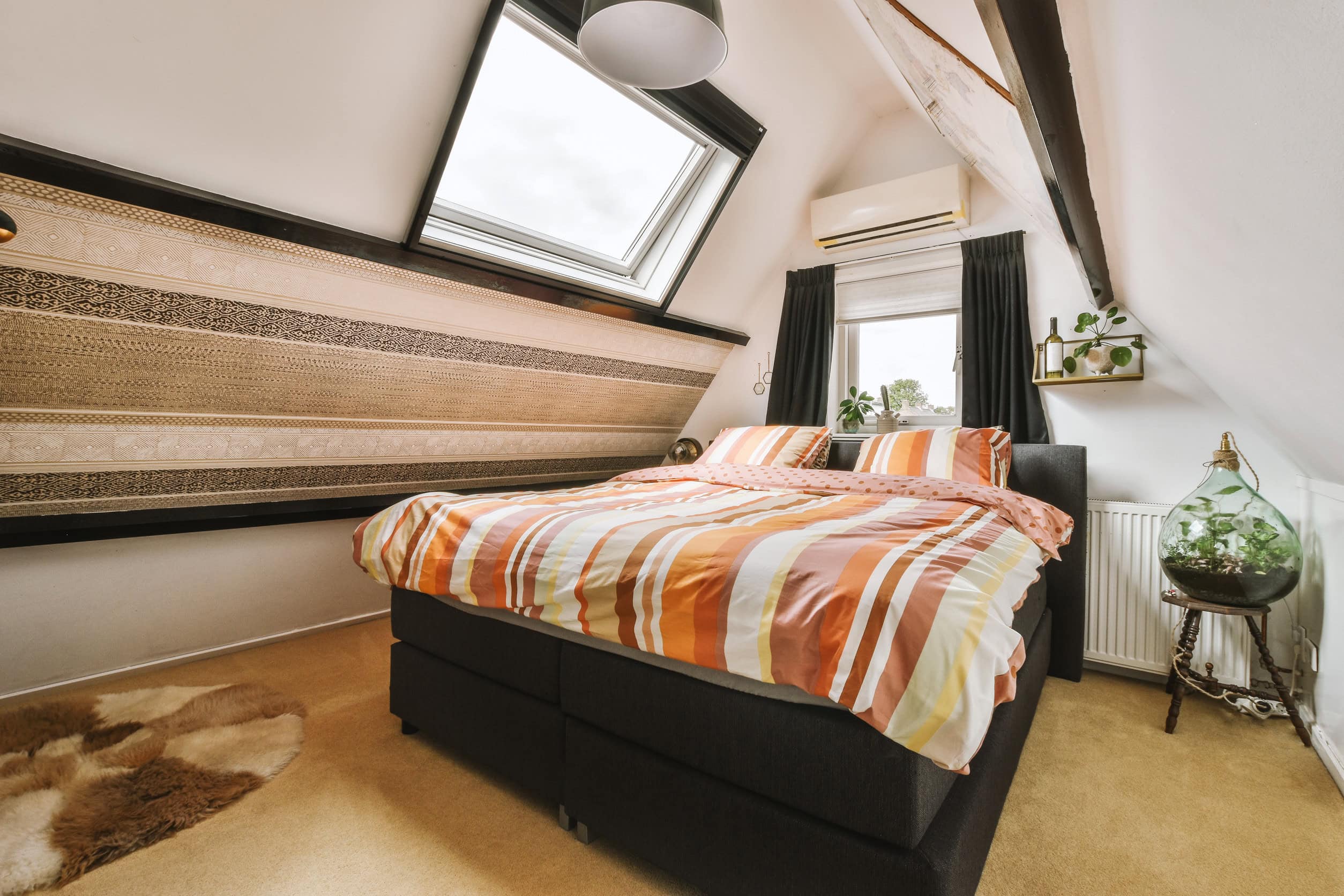 Small bedroom with wooden furniture Attic Additions