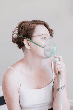 A person using a nebulizer