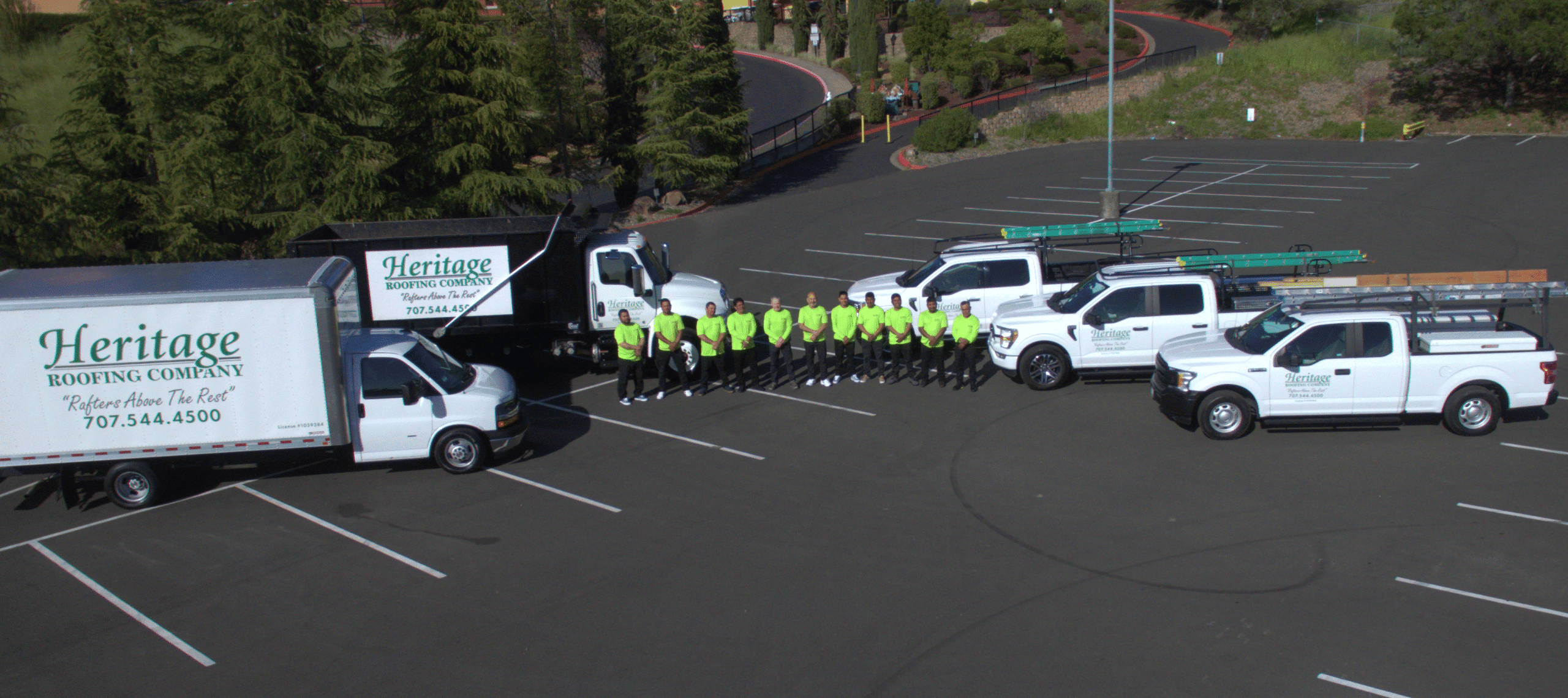 Heritage crew team gathered together with company trucks