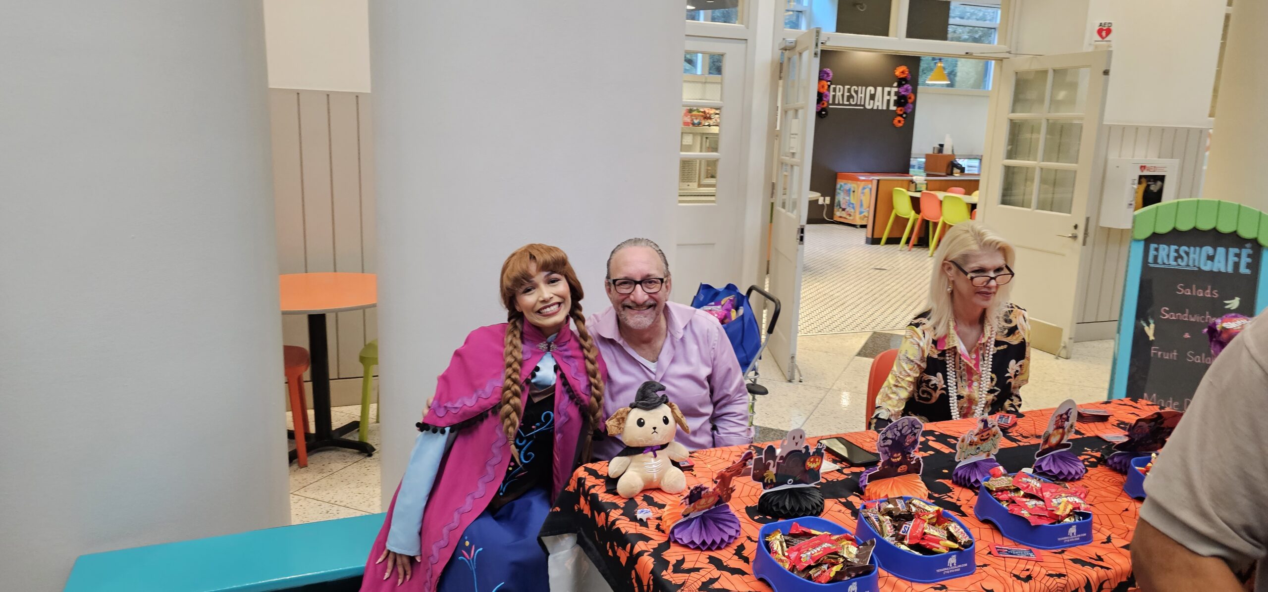 Adam Miller with princess character at Houston Halloween event for kids