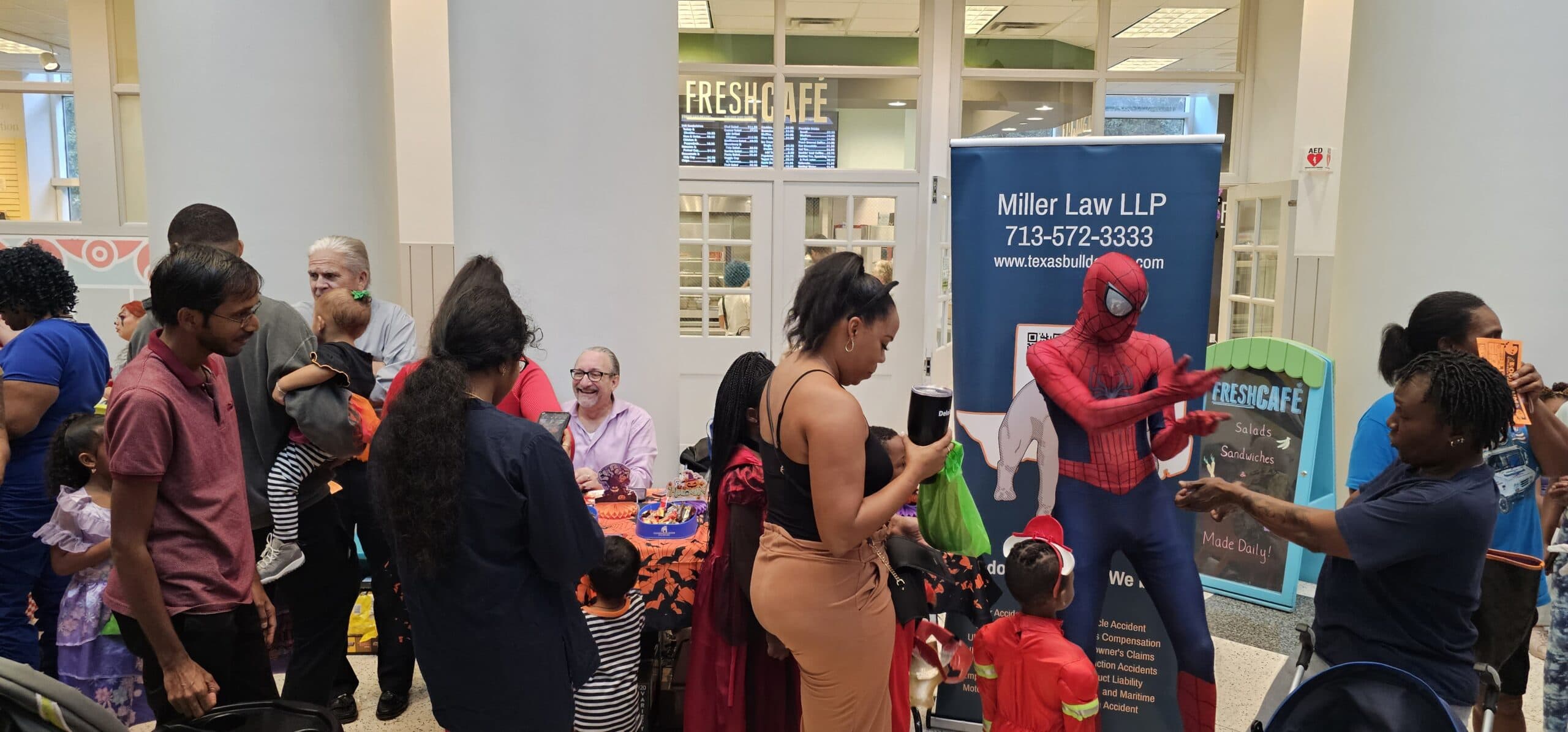 Spiderman interacting with kids at Houston children’s museum Halloween event
