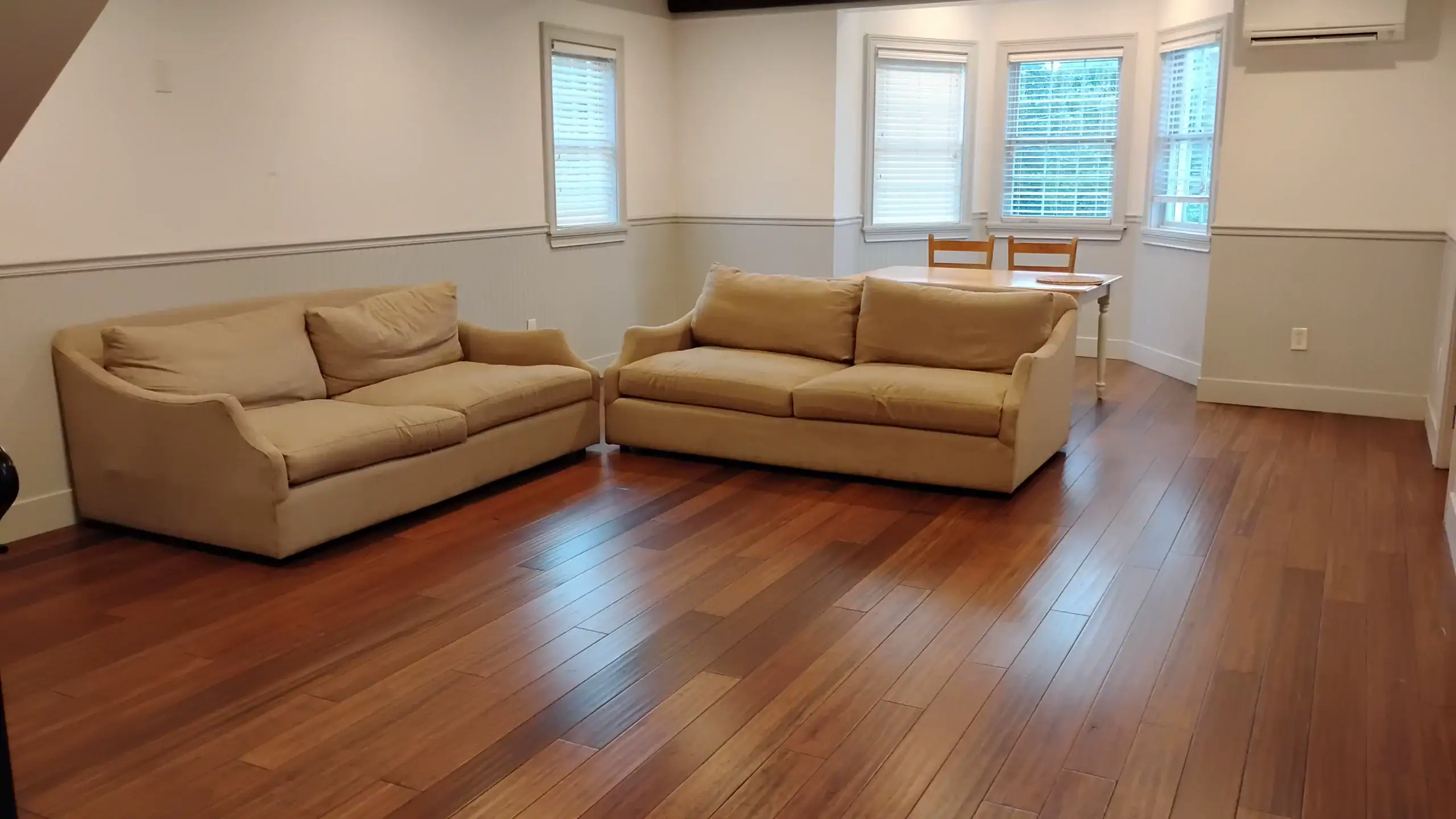 Professionally cleaned living room and hardwood floor after DSS Flex Priority Cleaning in Charleston, South Carolina