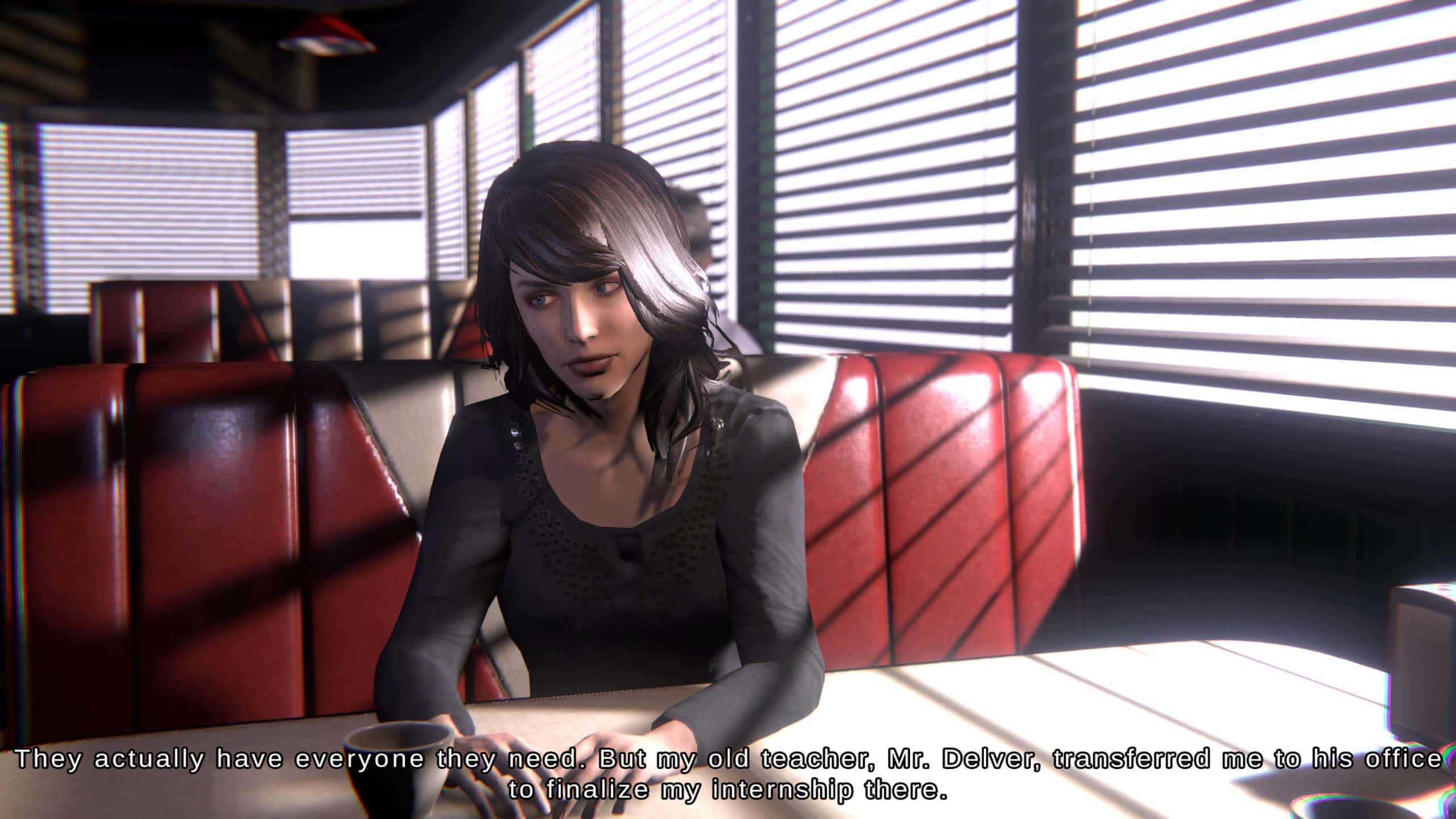 Screenshot from Mortuary Assistant. The character Rebecca sits in an American diner across from her grandmother. She has dark brown hair and is wearing a black shirt.