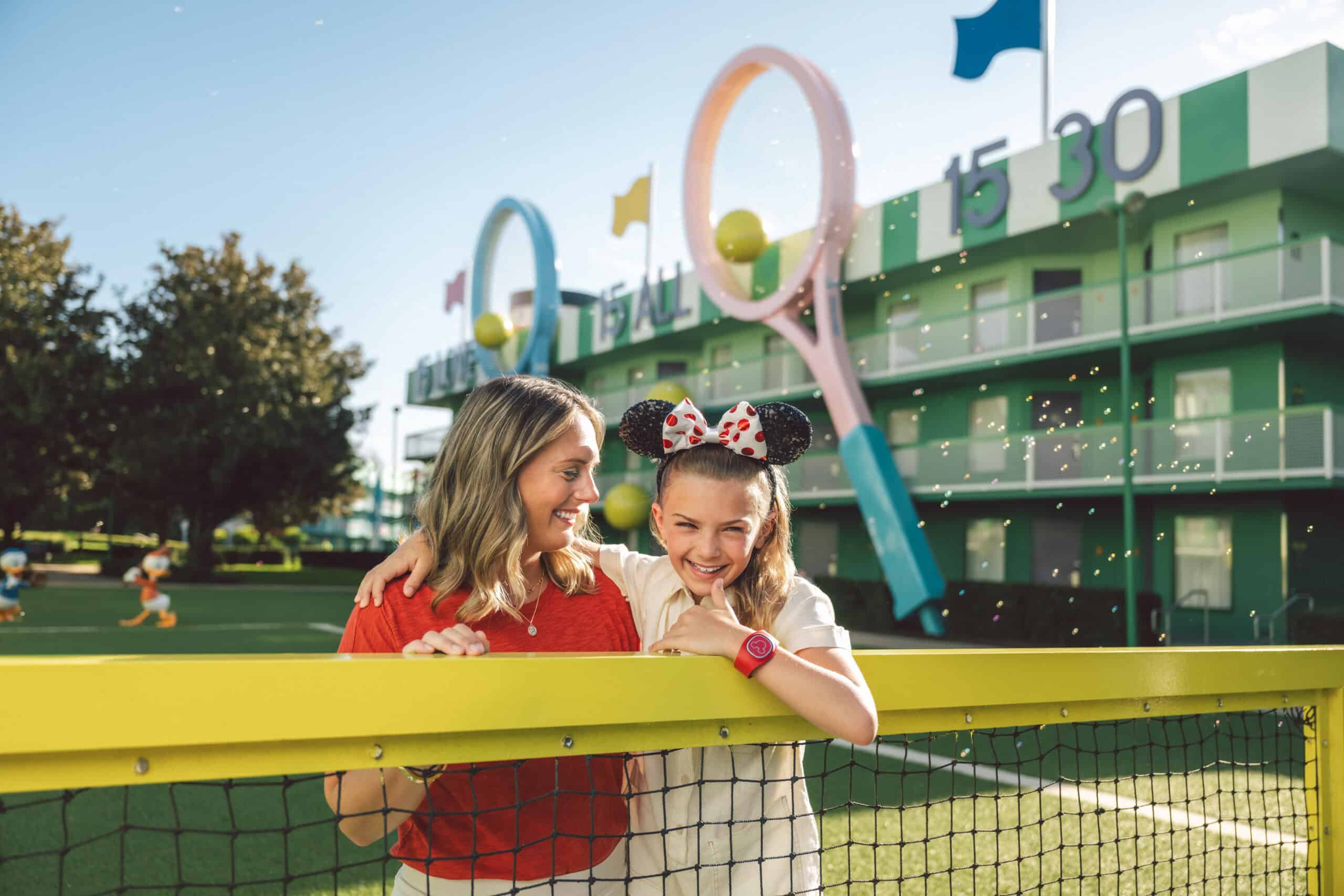 Happy family enjoying Disney World summer vacation at Walt Disney Resort.
