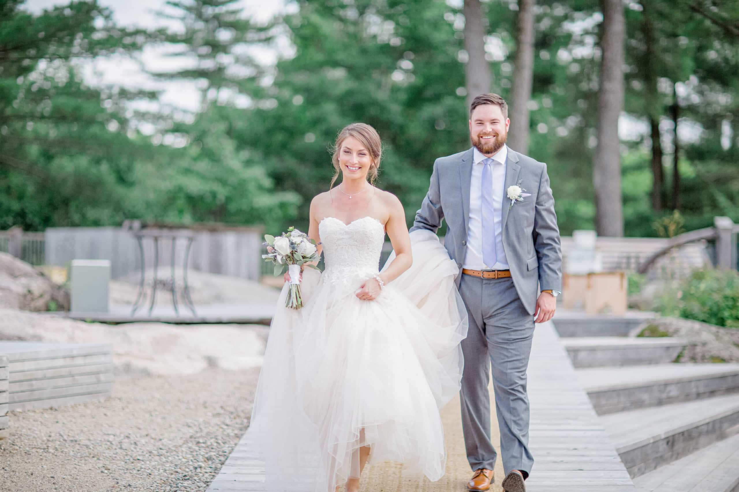 Bride and Groom Walking - Groom Holding Dress for Bride - Happy Wedding Day