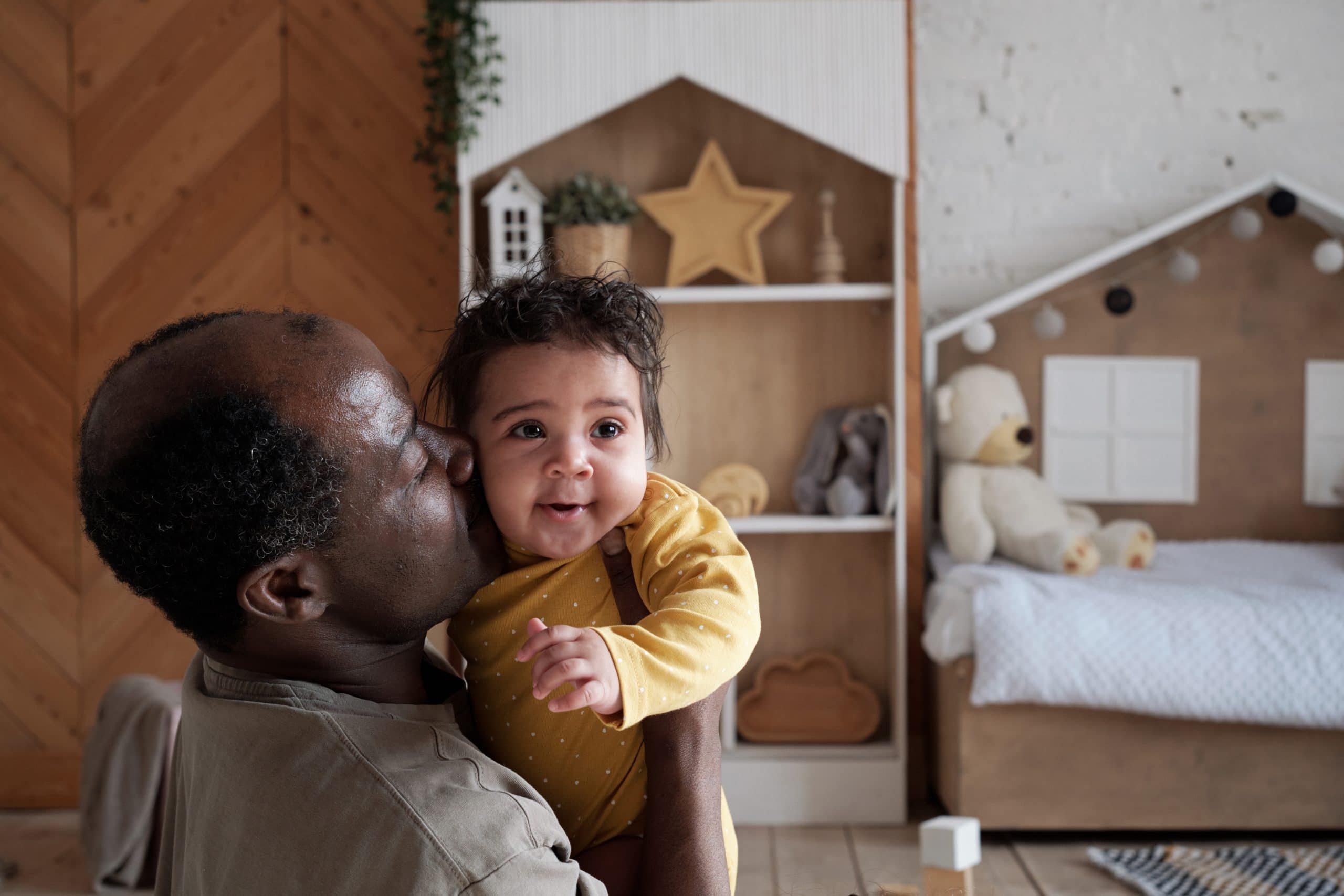 Man Kissing His Child