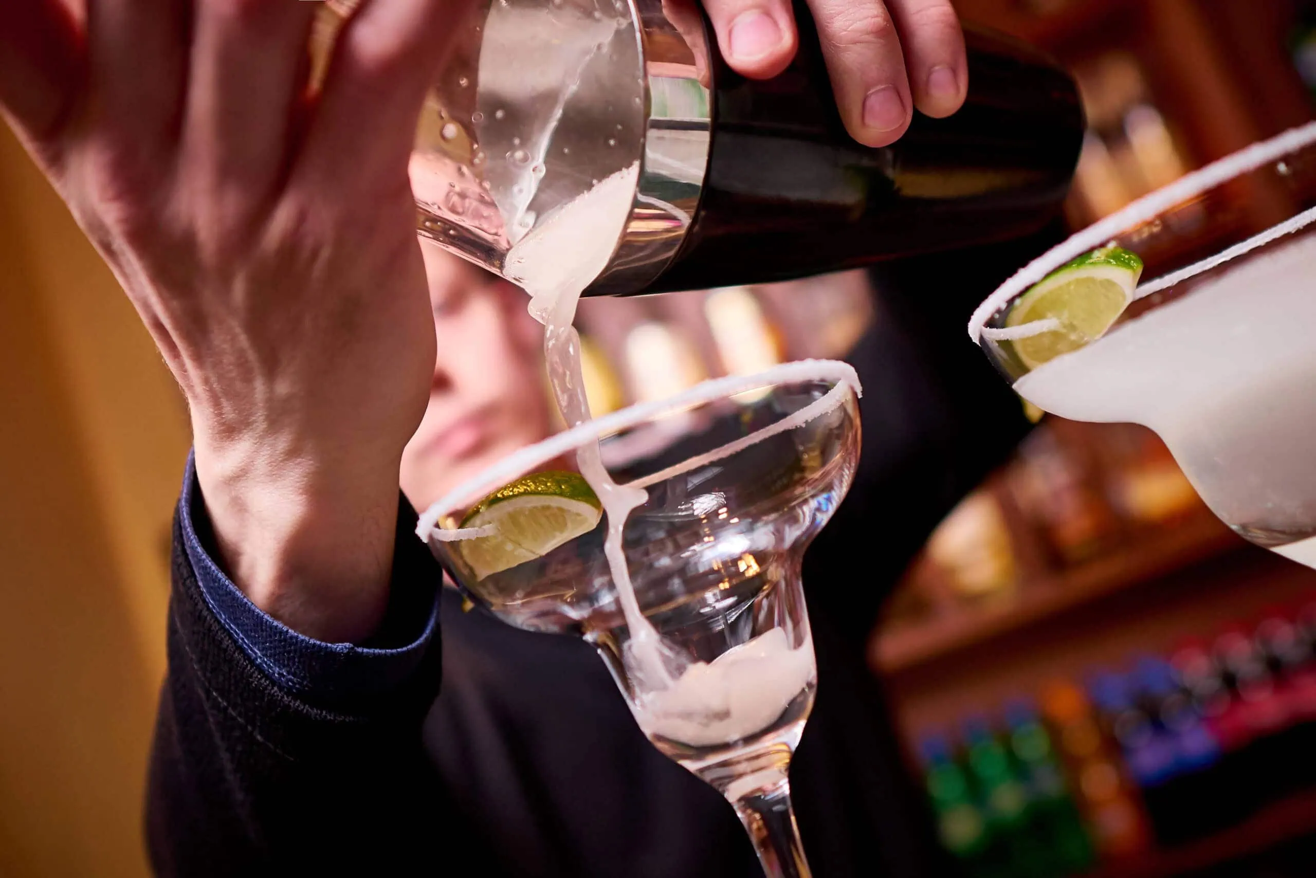 Bartender mixing spirits with vodka