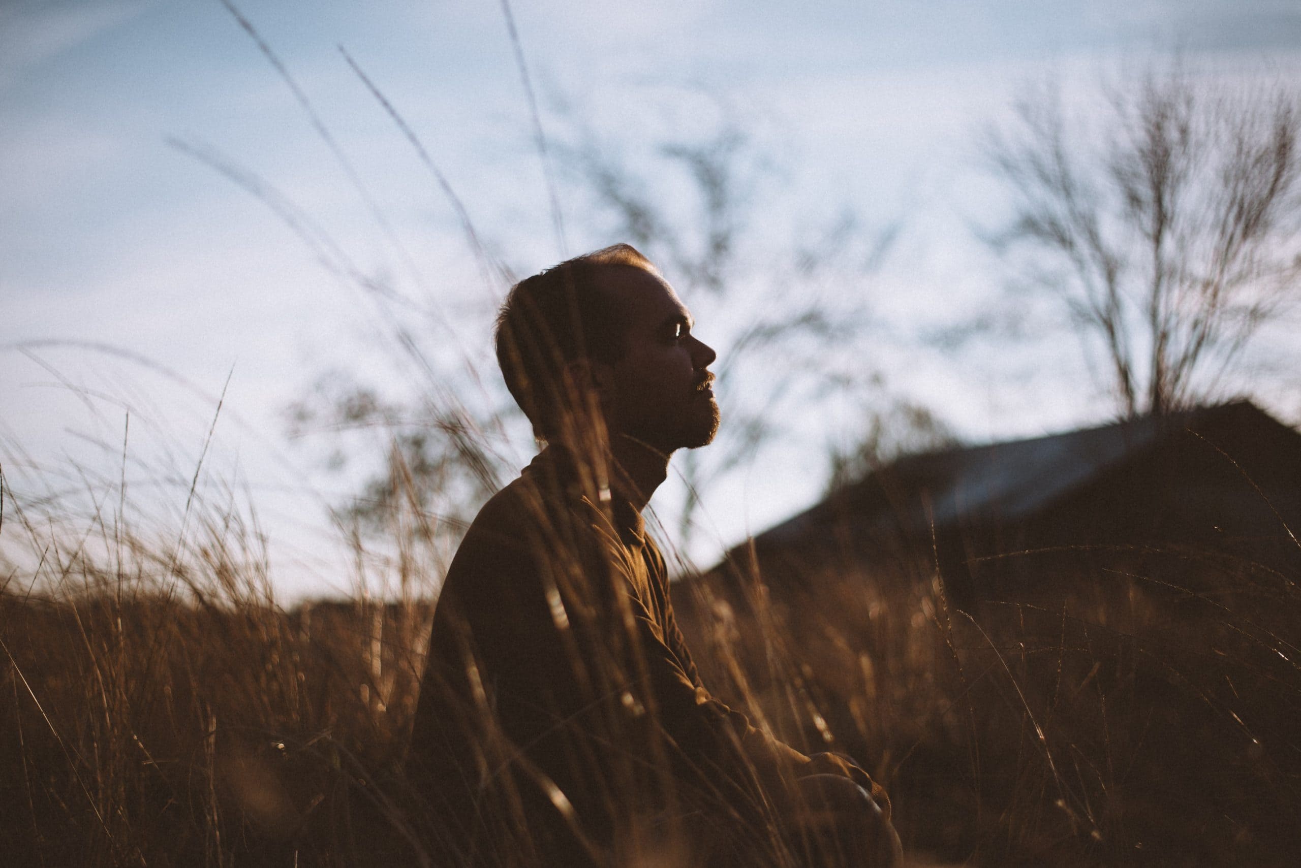 Man meditating outside