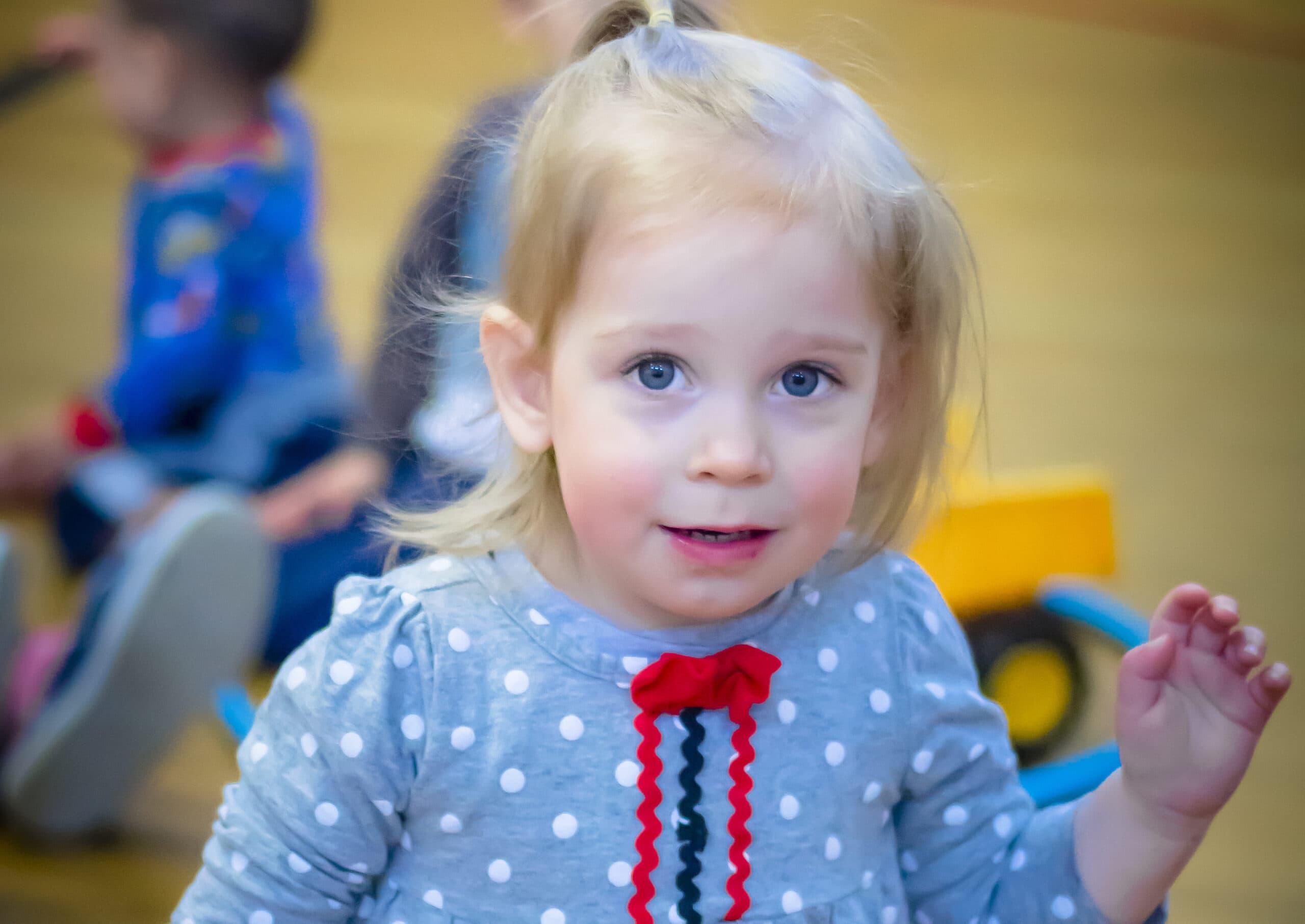 A little girl in a polkadot shirt | Bishop Hamilton Montessori School in Ottawa