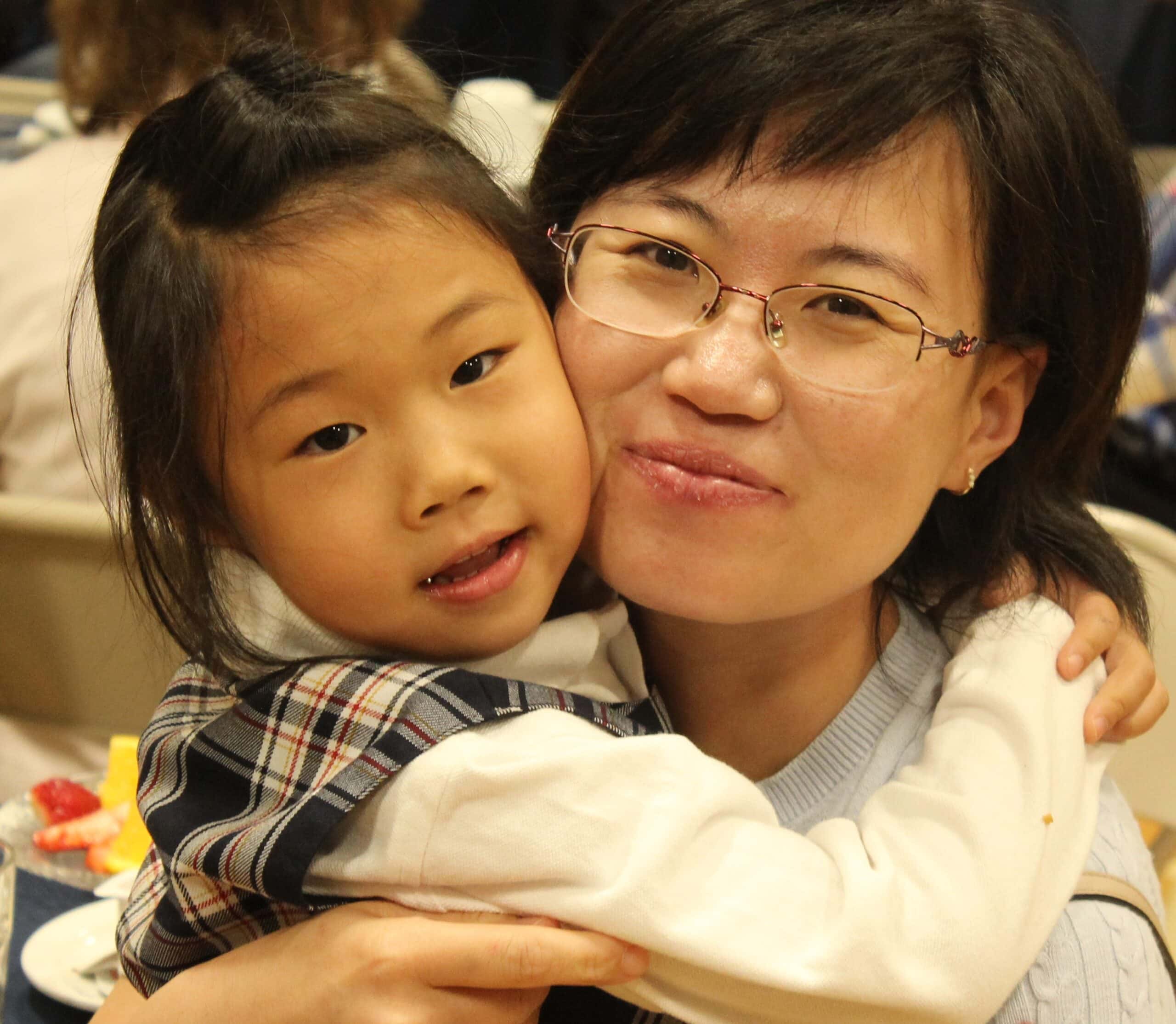 A mom and her daughter hugging | Bishop Hamilton Montessori School in Ottawa