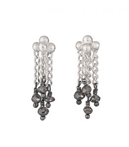 Photo of diamond and silver chain earrings on white background