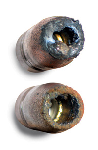 Image of spatter buildup on two nozzles