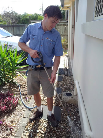 Mick spraying ground One of our inspectors spraying ground and doing a treatment