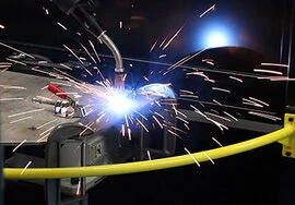 Robotic MIG gun welding with sparks