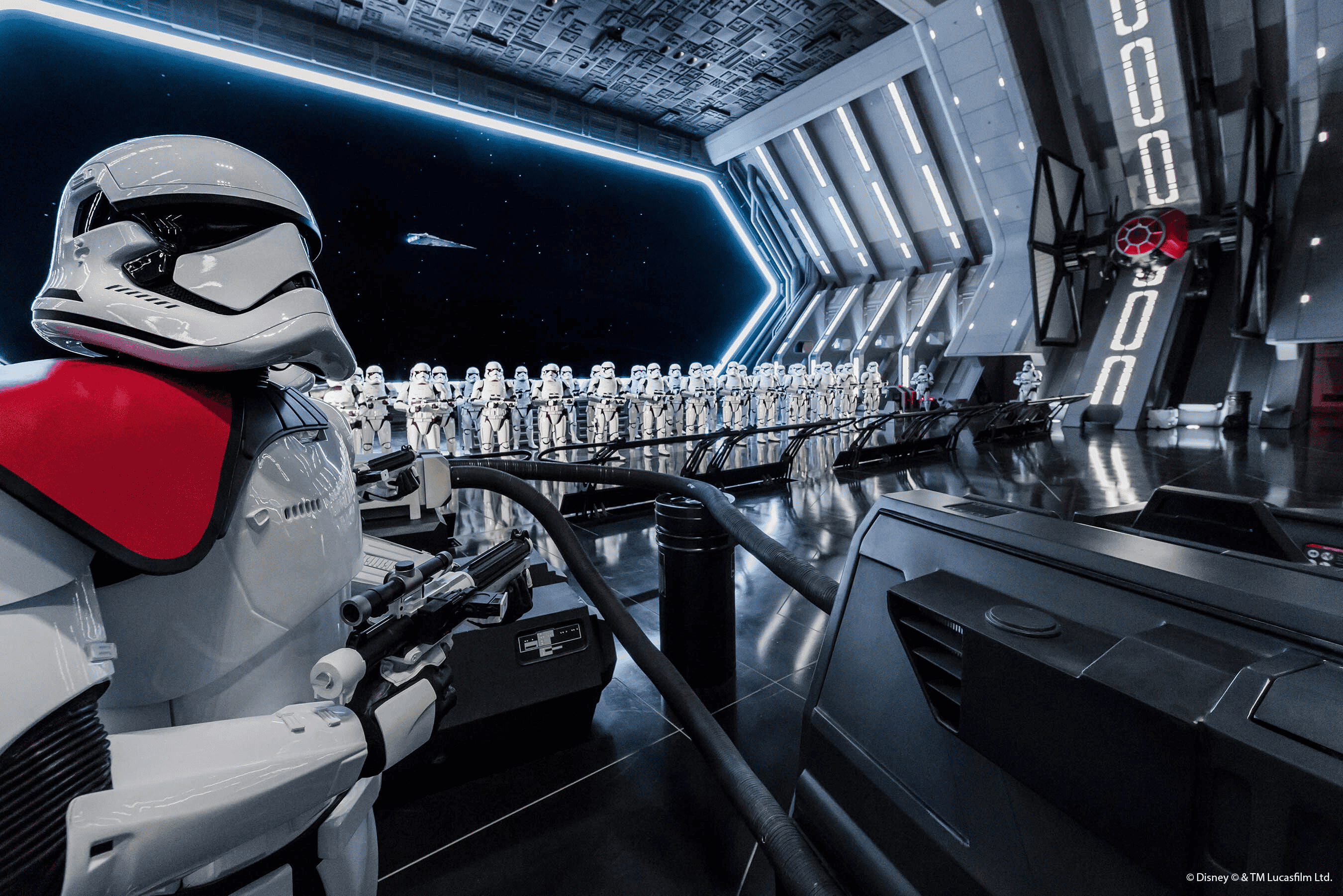 Stormtrooper helmet and figures from Star Wars in a sci-fi spaceship setting, promotional for space adventure travel.