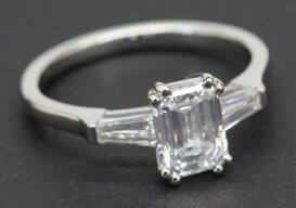 Silver ring with a large emerald-cut diamond gemstone for women.