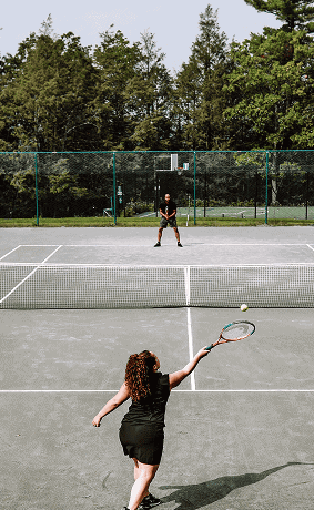 People Playing Tennis at Our New York Resort