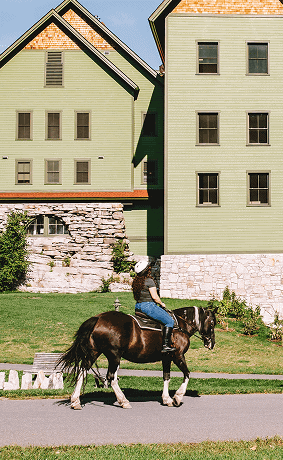 Person Riding a Horse Outside of Our Resort in New York
