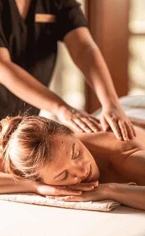 Woman Receiving a Massage During a Wellness Spa Retreat