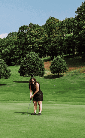 Woman Playing Golf on Our Hudson Valley Resort's Golf Course
