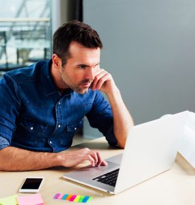 person figuring out how much it costs to buy a franchise