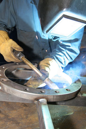 Image of an OEM welding with a MIG gun