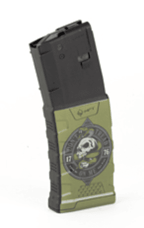 Two-tone green and black handheld gadget with a circular dial featuring a skull emblem on the front.
