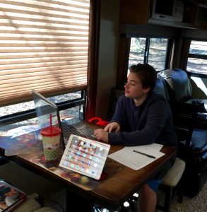 Elijah doing his Pre-Algebra on the computer. We LOVE Teaching Textbooks!