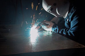 Image of welder, welding in a semi-automatic application