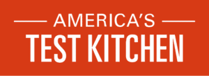 Logo of America's Test Kitchen featuring white uppercase text on a red background, with 'AMERICA'S' in a smaller font above 'TEST KITCHEN,' which is bold and prominent. Horizontal lines flank 'AMERICA'S' for visual emphasis.
