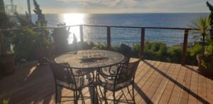 wooden porch with beach view