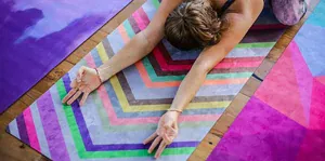 woman doing yoga on a yoga mat
