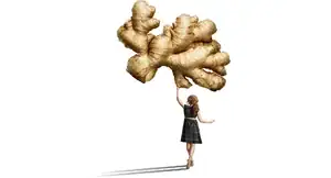 girl holding up a giant ginger