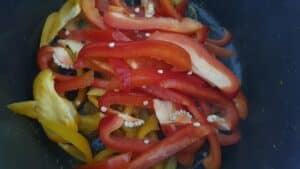 stir frying the capsicum.