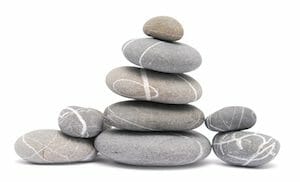 balancing pebbles isolated on white