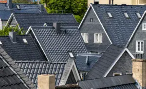 Rooftops of homes covered with different roof shingle types