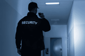 security gaurd waliking hallway 