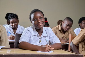 Engaged students studying in a diverse classroom environment, showcasing educational commitment.