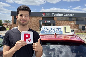 A D-Tech driving school vehicle parked outside the Service NSW St Marys test center.