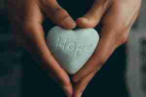 Picture of a rock that is engraved "hope" representing how hope helps heal complex trauma. Start PTSD treatment today near me