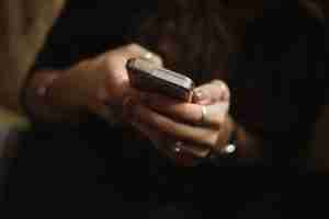 person using smartphone calling the suicide hotline in Detroit Michigan due to suicidal thoughts