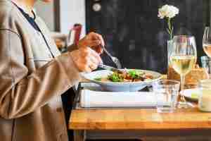 person eating vegetable salad. Looking for ways to help a loved one dealing with anxiety? Speak with a caring anxiety therapist in Ann Arbor. Visit us today to get started with anxiety treatment in Ann Arbor, MI.