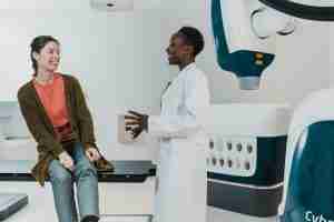 A doctor and patient in conversation, reflecting how online emdr treatment in Michigan supports medical trauma recovery