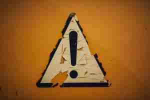 A bright warning sign stands against the sky, a reminder of the red flags addressed in PTSD therapy in Detroit, MI.
