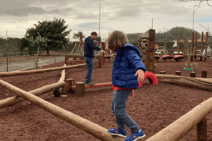 Child and dad on playground practicing kids safety tips shared by gowhee