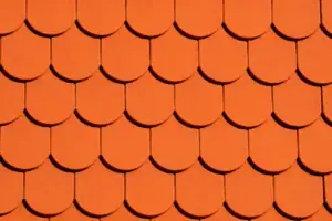 Close-up of overlapping roof shingles in need of repair checks