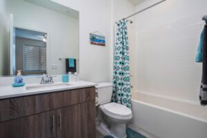 Private ensuite bathroom for the at 5235 Beachfront Cove Unit 102, ideal for an in-law suite or guest use.