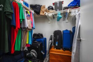 Spacious walk-in closet in the primary suite of 5235 Beachfront Cove Unit 102, providing ample storage for residents.