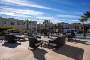 Exclusive rooftop lounge at Playa Del Sol overlooking the swim club and spa, providing resort-style outdoor seating